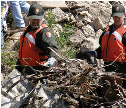 National Park Service personnel check over a load to be picked up along the Missouri River during the sixth annual Missouri River Clean-up. (Paul Lepisto)