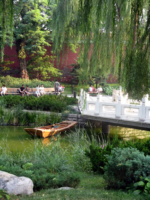 A splendid formal garden just to the east of the Forbidden City holds picturesque treasures, such as this boat on a winding canal. (Jane Hanson)