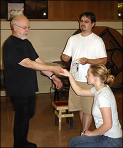 Bob Hall directs Dave Owens as the King of France and Kara Davidson as Cordelia in rehearsal for the Flatwater Shakespeare production of King Lear.
